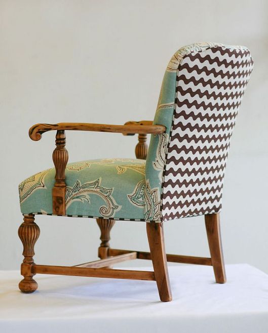 This two fabric combination will fit more easily into a scheme than the patchwork chair. I like the way the Jacobean-inspired material on the seat fits with the medieval look of the chair, with the Chevron stripes adding a modern twist.