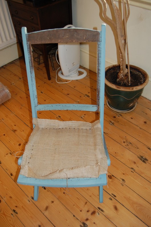 I stretched a piece of hessian, taut over the webbing and attached a piece to form a base over the back. I also painted the frame with Annie Sloan no-prep chalk paint and distressed slightly. Annie Sloan paint needs a protective rub of wax to seal but you can paint over the original varnish so its very quick and easy. 